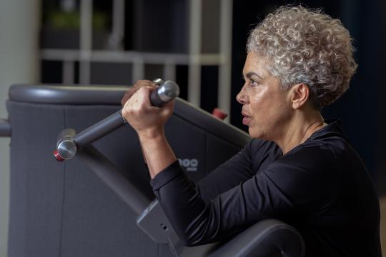 Older woman on Smart Strength machine